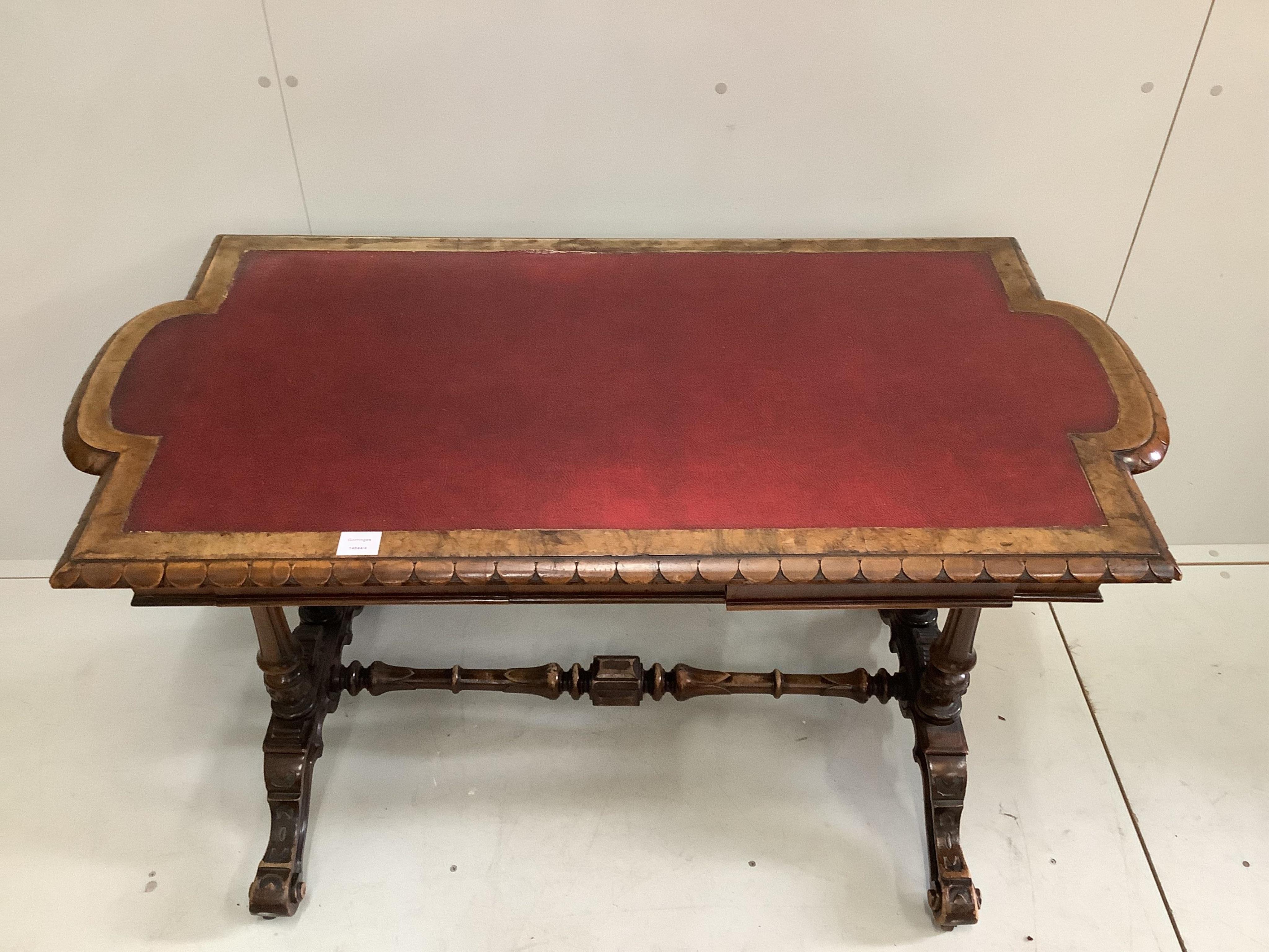 An early Victorian rectangular walnut writing table, width 126cm, depth 64cm, height 73cm. Condition - fair